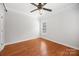 Comfortable bedroom with hardwood floors and a ceiling fan for climate control at 206 Coburn Ct, Fort Mill, SC 29715