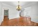 Open dining room flows to other rooms with hardwood floors and traditional décor at 206 Coburn Ct, Fort Mill, SC 29715
