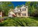 Beautiful two-story brick home with well-maintained lawn and mature trees at 206 Coburn Ct, Fort Mill, SC 29715
