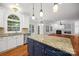 Gourmet kitchen features an island with seating and sink, plus stainless appliances, and granite counters at 206 Coburn Ct, Fort Mill, SC 29715