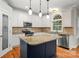 Beautiful kitchen with granite countertops, island with seating, stainless appliances, and white cabinets at 206 Coburn Ct, Fort Mill, SC 29715