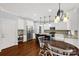 Eat-in kitchen featuring white cabinets, stainless appliances, and a center island at 206 Coburn Ct, Fort Mill, SC 29715