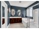This main bathroom has a double vanity, large soaking tub, and shower with glass surround at 206 Coburn Ct, Fort Mill, SC 29715