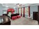 Relaxing main bedroom featuring a trey ceiling, red accents, and natural light at 206 Coburn Ct, Fort Mill, SC 29715