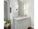 Bathroom featuring white vanity with marble countertop and framed mirror at 2219 Richardson Dr, Charlotte, NC 28211