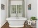 Elegant bathroom with standalone tub and vintage-style fixtures at 2219 Richardson Dr, Charlotte, NC 28211