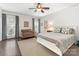 Light and airy bedroom with hardwood floors, neutral walls, stylish furniture, and bright natural light at 2219 Richardson Dr, Charlotte, NC 28211