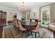 Elegant dining room with large windows, chandelier, and decorative rug is perfect for entertaining at 2219 Richardson Dr, Charlotte, NC 28211