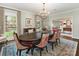 Elegant dining room with large windows, chandelier, and decorative rug is perfect for entertaining at 2219 Richardson Dr, Charlotte, NC 28211