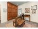 Hallway featuring a custom built-in cabinet, decorative art, and bench at 2219 Richardson Dr, Charlotte, NC 28211