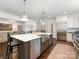 A spacious kitchen with a marble island, stainless steel appliances, and hardwood flooring at 2219 Richardson Dr, Charlotte, NC 28211