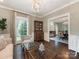 Cozy living room featuring a plush sofa, stylish decor, and large windows with natural light at 2219 Richardson Dr, Charlotte, NC 28211