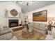 Bright living room with a cozy fireplace, chandelier, and neutral decor at 2219 Richardson Dr, Charlotte, NC 28211