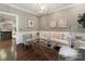 Comfortable living room with stylish seating, glass tables, decor and views to other rooms at 2219 Richardson Dr, Charlotte, NC 28211