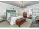 Spacious main bedroom featuring elegant décor, a sitting area, and hardwood floors at 2219 Richardson Dr, Charlotte, NC 28211