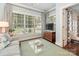 Sitting room with lots of light, neutral colors, and access to another room at 2219 Richardson Dr, Charlotte, NC 28211