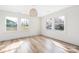 Spacious bedroom with hardwood floors, a contemporary light fixture, and plenty of natural light at 2230 W 6Th Ave, Gastonia, NC 28052