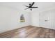 Bright bedroom featuring neutral walls, wood floors, and ample closet space at 2230 W 6Th Ave, Gastonia, NC 28052