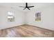Bright bedroom featuring neutral walls, wood floors, and ample natural light from two windows at 2230 W 6Th Ave, Gastonia, NC 28052