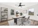Well-lit home office with modern desk, shelving, and a comfortable workspace at 2230 W 6Th Ave, Gastonia, NC 28052