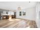 Bright living room with hardwood floors, a contemporary light fixture, and plenty of natural light at 2230 W 6Th Ave, Gastonia, NC 28052