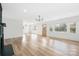 Open-concept living room with hardwood floors, lots of windows and natural light at 2230 W 6Th Ave, Gastonia, NC 28052