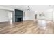 Open-concept living room with fireplace and light hardwood floors at 2230 W 6Th Ave, Gastonia, NC 28052