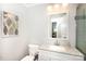 Clean bathroom featuring neutral granite countertop and white fixtures at 2404 Finchley Dr, Charlotte, NC 28215