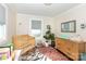 Bright Bedroom features natural wood crib, dresser, and colorful rug at 2404 Finchley Dr, Charlotte, NC 28215