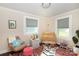 Charming Bedroom with a crib, rocking chair, and colorful accents at 2404 Finchley Dr, Charlotte, NC 28215