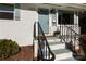 Inviting front entrance with light blue door, decorative iron railing, and manicured landscaping at 2404 Finchley Dr, Charlotte, NC 28215