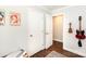 Hallway featuring hardwood floors and access to other rooms at 2404 Finchley Dr, Charlotte, NC 28215