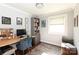 Well-lit home office with built-in shelving and comfortable workspace at 2404 Finchley Dr, Charlotte, NC 28215