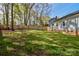 Spacious backyard featuring green lawn, surrounded by a wooden fence at 2731 Bishopton Pl, Charlotte, NC 28216