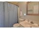 Neat bathroom featuring a shower curtain and white fixtures at 2731 Bishopton Pl, Charlotte, NC 28216