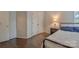 Bedroom view highlighting a black metal bed frame and hardwood flooring at 2731 Bishopton Pl, Charlotte, NC 28216
