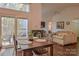Bright dining area with access to the living room and a sliding glass door for outdoor access at 2731 Bishopton Pl, Charlotte, NC 28216