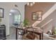 Cozy dining room featuring a modern chandelier, stylish chairs, and a view of the adjacent kitchen at 2731 Bishopton Pl, Charlotte, NC 28216