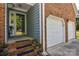 Inviting front porch with brick steps, a storm door, and access to an attached two-car garage at 2731 Bishopton Pl, Charlotte, NC 28216