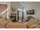 Bright living room featuring a cozy fireplace, large windows, and a comfortable seating area at 2731 Bishopton Pl, Charlotte, NC 28216