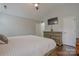 A nicely decorated main bedroom featuring tray ceiling, closet, and adjoining bath at 2731 Bishopton Pl, Charlotte, NC 28216