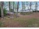 Wooded lot with stone firepit at 2749 Old Nation Rd, Fort Mill, SC 29715