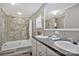 Bathroom with double vanity, shower-tub combo, modern fixtures and laminate flooring at 2749 Old Nation Rd, Fort Mill, SC 29715