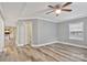 Comfortable bedroom showcasing stylish flooring, neutral paint, and a ceiling fan with lighting at 2749 Old Nation Rd, Fort Mill, SC 29715