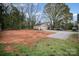 Expansive backyard with a detached garage and ample space for various outdoor activities and landscaping at 308 Birch St, Lowell, NC 28098