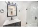 Stylish bathroom with modern vanity, frameless shower, and sleek fixtures at 308 Birch St, Lowell, NC 28098