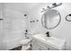 Modern bathroom features a shower-tub combo, updated vanity, and clean finishes at 308 Birch St, Lowell, NC 28098