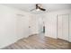 Bright bedroom features three closets, ceiling fan, and neutral paint to create a relaxing space at 308 Birch St, Lowell, NC 28098