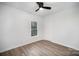 Bright bedroom features a closet, ceiling fan, and neutral paint to create a relaxing space at 308 Birch St, Lowell, NC 28098