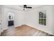 Bright bedroom features closet, access to bathroom, ceiling fan, and neutral paint at 308 Birch St, Lowell, NC 28098